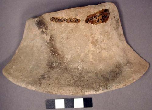 Ceramic rim sherd, flared, exterior fire-clouded, unpolished, undecorated