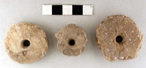 Perforated discoidal stones