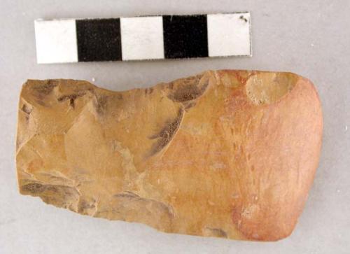 Chipped stone edge tool, biface, top broken off