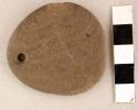 Ground stone ornament, pendant, round with perforation