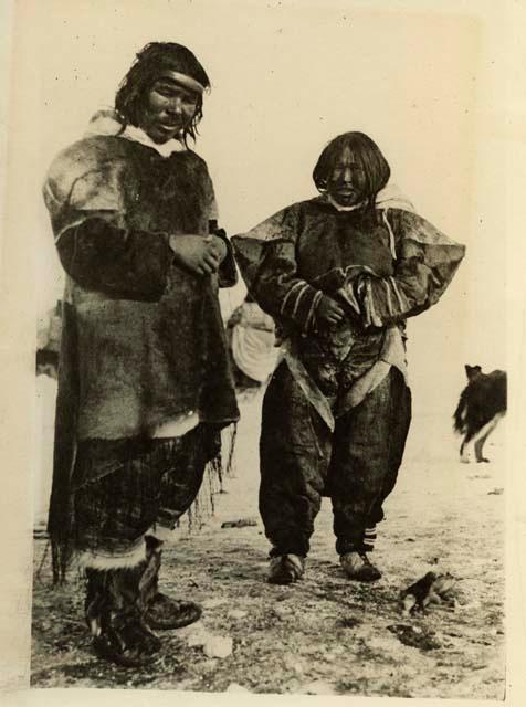 Inuit man and woman wearing traditional clothing