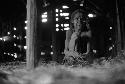 Samuel Putnam negatives, New Guinea. woman looks out the door in a hunu in Abulupak