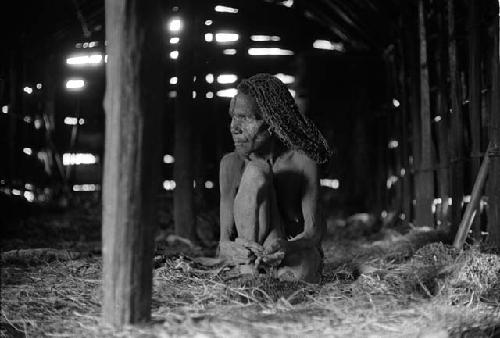 Samuel Putnam negatives, New Guinea. Laro working in a field; directly west of Homoak; stands and calls to someone