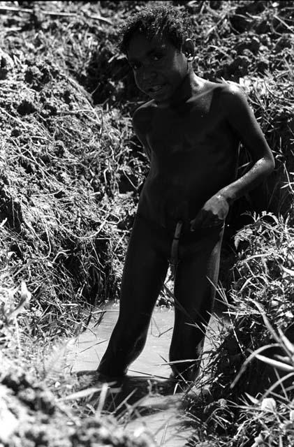 Samuel Putnam negatives, New Guinea. Tukom washing in the little creek