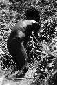 Samuel Putnam negatives, New Guinea.Tukom washing in the little creek; splashes water on his face