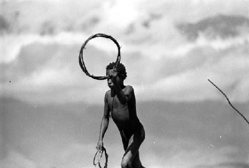 Samuel Putnam negatives, New Guinea. Kousa about to throw a hoop during the game