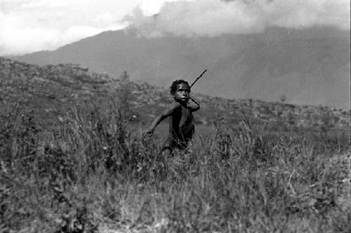 Samuel Putnam negatives, New Guinea, Kousa about to throw a spear at a hoop