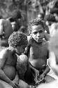 Isile and another little boy talking at the funeral