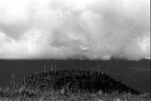 Samuel Putnam negatives, New Guinea; huge group of warriors standing on the northern most knoll of the north south ridge of the Warabara