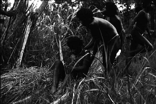 A wounded man being put into a stretcher