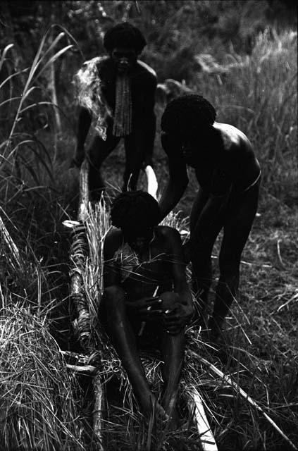 A wounded man being put into a stretcher