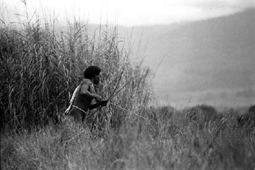 Samuel Putnam negatives, New Guinea; one warrior working towards the enemy