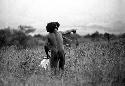 Samuel Putnam negatives, New Guinea; a man points out an enemy to another man; enemy not in view