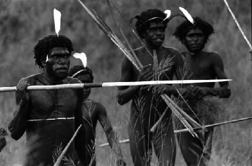 Samuel Putnam negatives, New Guinea; several warriors coming to the front