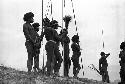 Samuel Putnam negatives, New Guinea; several warriors standing on the Warabara waiting for the battle