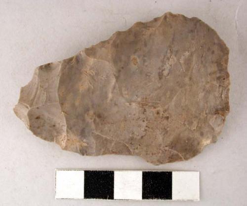 Chipped stone projectile point, triangular, rough