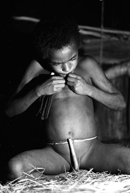 Uwar fixing his picon in a honai