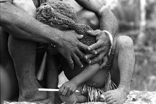 Samuel Putnam negatives, New Guinea; woman and little child; she holds it with her hands