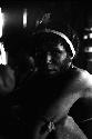 Samuel Putnam negatives, New Guinea; portrait of a man inside a hunu