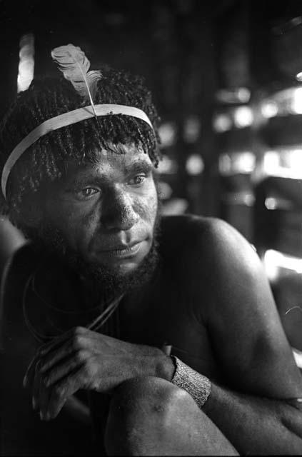 Samuel Putnam negatives, New Guinea; portrait of a man inside a hunu