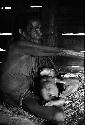 Samuel Putnam negatives, New Guinea; ; Aneake with small child in her lap in Wuperainma hunu