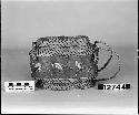 Grass basket with center band of bark; porcupine quill decoration