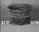 Utility basket with string handle. From the collection of G. Nicholson and C. Hartman. Open twined, overlay.