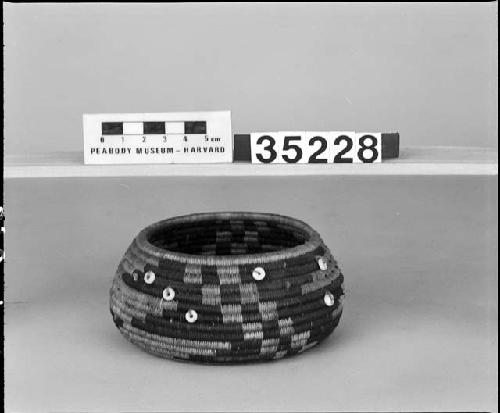 Feathered, beaded low-shouldered trinket basket. From the collection of Mrs. J.H. Page. Coiled.