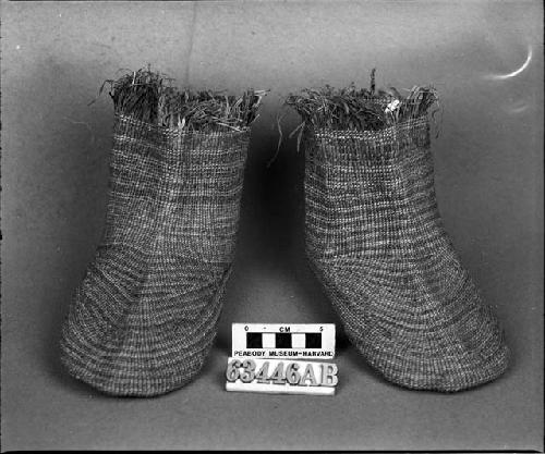 A pair of grass socks. A gift from L.H. Farlow.