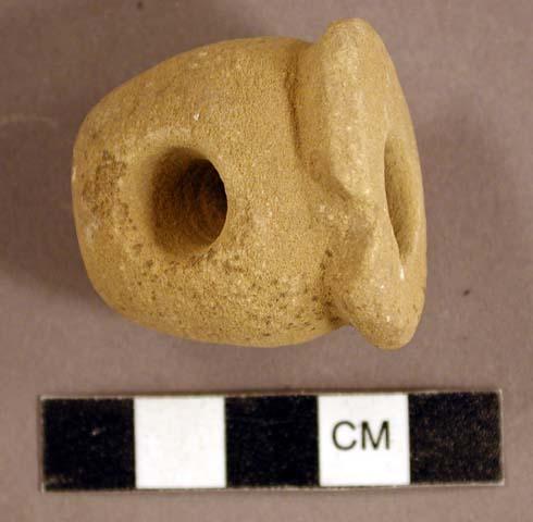 Ground stone, pipe, flared rim