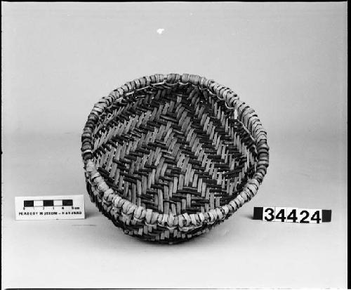 Reproduction of a twilled ring basket with ornamental rim-braid. Original is from Mesa Verde, Pueblo III period and is now located in the Colorado State Historical Society. Made by E.H. Morris, 1941. See Morris and Bugh, "Anasazi Basketry."