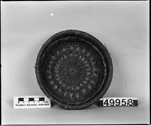 Small circular basket; coiling and twining techniques; early twentieth century. Western?