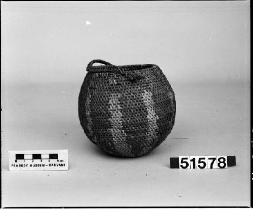 Coaise weave basket bowl with a globular shape and radiating pattern. Belonged to the donor's grandfather, probably from 1900-1915.