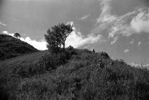 Samuel Putnam negatives, New Guinea; a man sits on the Anelerak