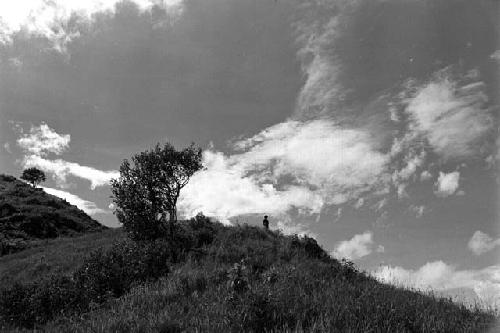 Samuel Putnam negatives, New Guinea; a man sits on the Anelerak