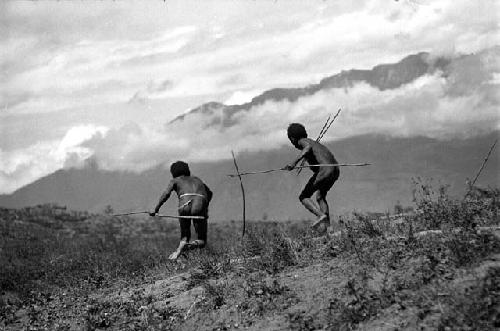 Samuel Putnam negatives, New Guinea; boy throws a spear