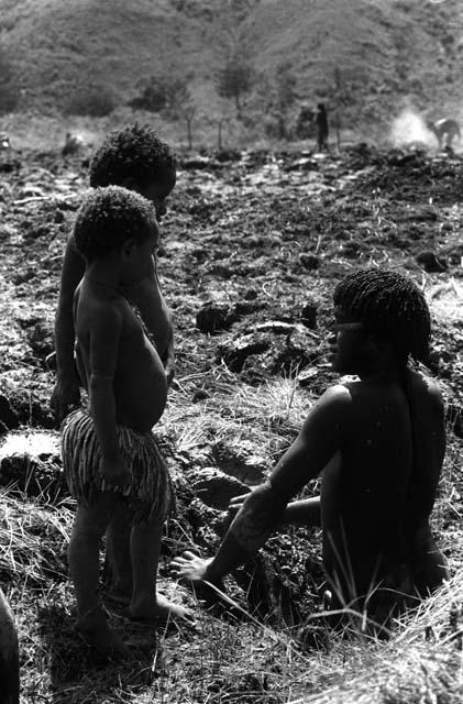 Samuel Putnam negatives, New Guinea; 2 children near Aikpon working in a garden ditch