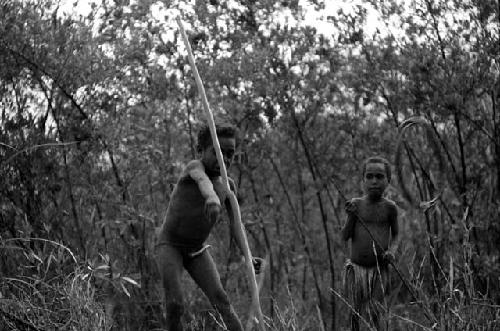 Samuel Putnam negatives, New Guinea; Tukom has just thrown his spear at a hoop that comes by