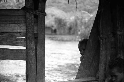 Samuel Putnam negatives, New Guinea; Uwar oustide sili of Wuperainma and Natorek just inside the doorway