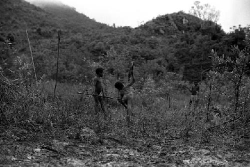 Samuel Putnam negatives, New Guinea;little boy throwing the hoop