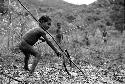 Samuel Putnam negatives, New Guinea; boy with hoop and a spear he has just thrown into it