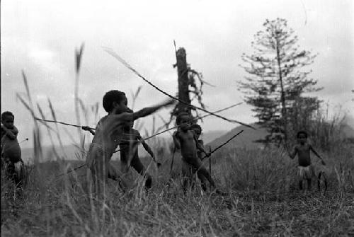 Samuel Putnam negatives, New Guinea; boys and girls playing sikoko wasin