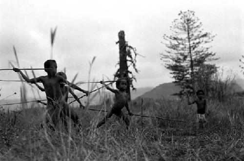 Samuel Putnam negatives, New Guinea; boys and girls playing sikoko wasin