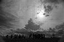 Samuel Putnam negatives, New Guinea; silhouetted men and women dancing late at an Etai