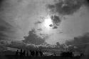 Samuel Putnam negatives, New Guinea; silhouetted men and women dancing late at an Etai