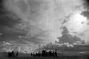 Samuel Putnam negatives, New Guinea; silhouetted men and women dancing late at an Etai