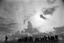 Samuel Putnam negatives, New Guinea; silhouetted men and women dancing late at an Etai