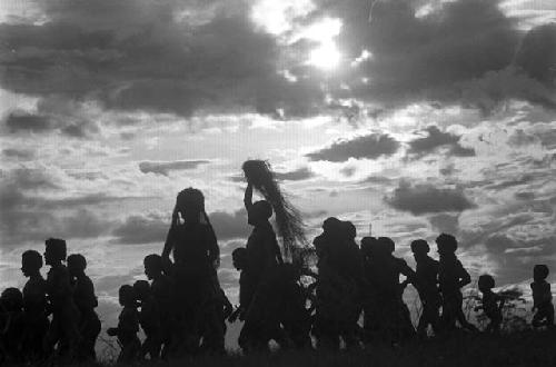 Samuel Putnam negatives, New Guinea; a group of women and men running