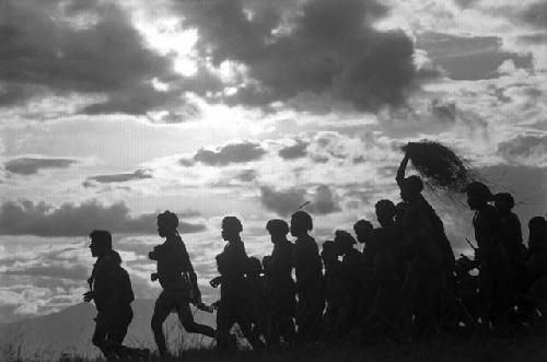 Samuel Putnam negatives, New Guinea; a group of women and men running