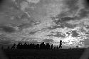 Samuel Putnam negatives, New Guinea; silhouetted figures against a beautiful cloudy sky